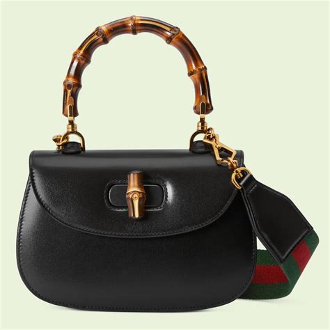 borsa gucci manico in bamboo|Borsa a mano Gucci Bamboo 1947 con jumbo GG .